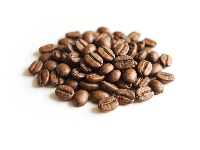 A small heap of roasted coffee beans